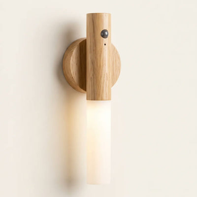 SENZIA lamp with a light oak effect finish and motion sensor, on its disc base